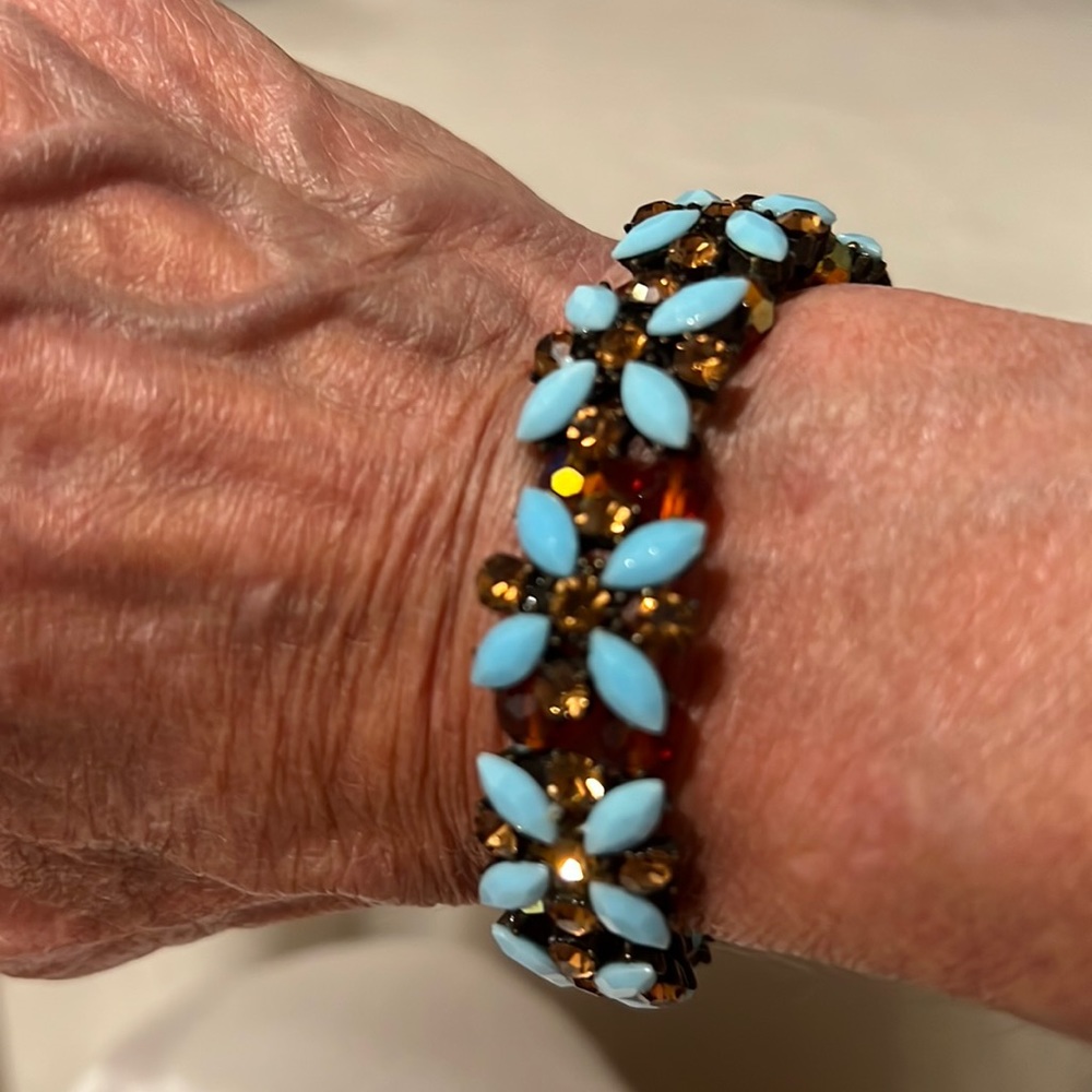 Beaded elastic bracelet with rhinestone accents.